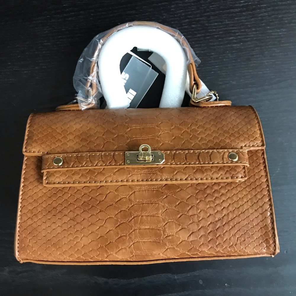 Small tan hand bag